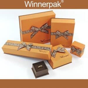 Complete wholesale collection of orange ribbon tied jewelry boxes in various sizes with open ring box